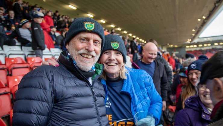 A man and lady with rugby beanie hats on